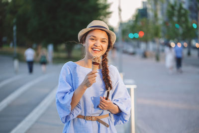 Portrait of woman eating ice cream