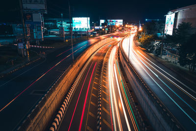 High angle view of light trails on road at night