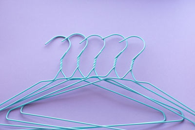 Hangers for clothes on purple background