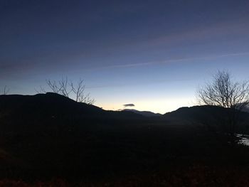 Silhouette landscape against clear sky