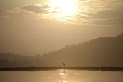 View of lake against sky during sunset