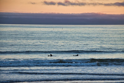 Scenic view of sea against sky during sunset