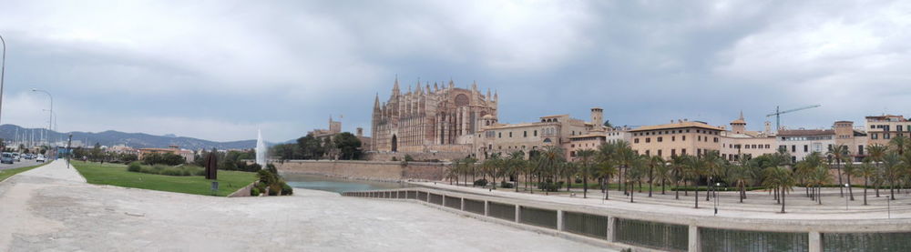 Panoramic view of buildings and city against sky