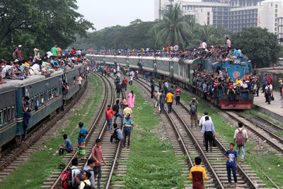 High angle view of people on railroad tracks
