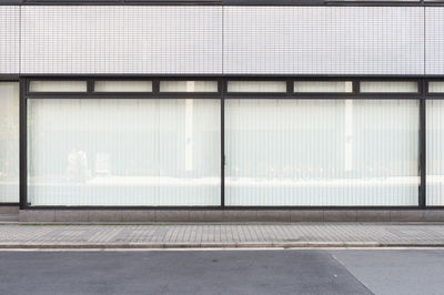 Road by building in city