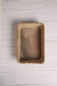 High angle view of bread on white table