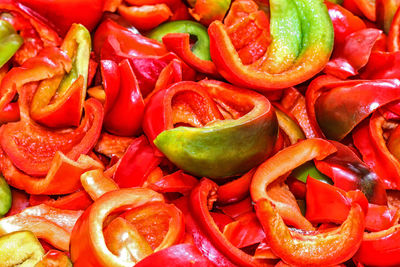 Background of the pieces of ripe chopped peppers