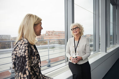Businesswomen talking during coffee break in office