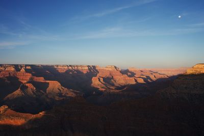 Rock formations on landscape against sky