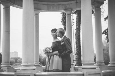 Young couple standing in corridor of building