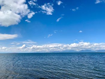 Scenic view of sea against blue sky