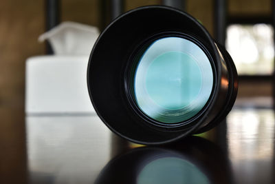Close-up of camera on table