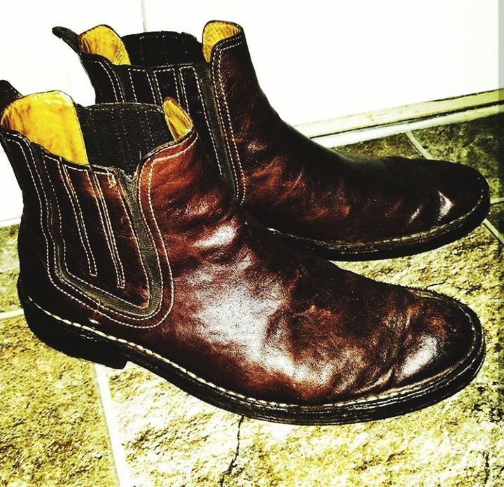 shoe, boot, pair, leather, close-up, black color, indoors, no people, shoelace, fashion, day, low section, still life, brown, focus on foreground, body part, jeans, personal accessory, compatibility, menswear