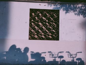 Shadow of woman on building wall