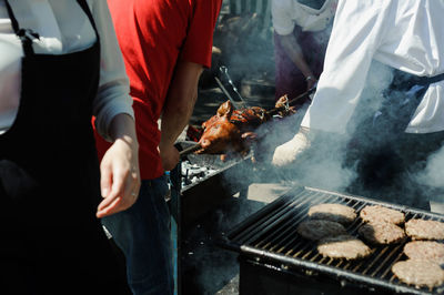 People preparing food outdoors