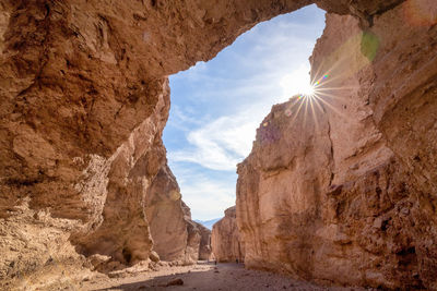 Sun shining through rocks