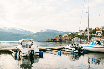 Boats moored at harbor