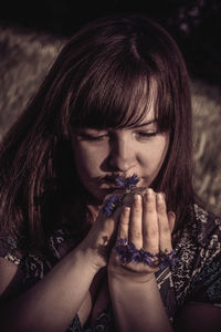 Close-up of woman smoking outdoors