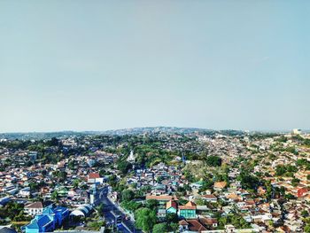 High angle shot of townscape against clear sky