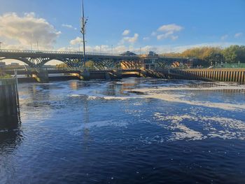 Bridge over river against sky