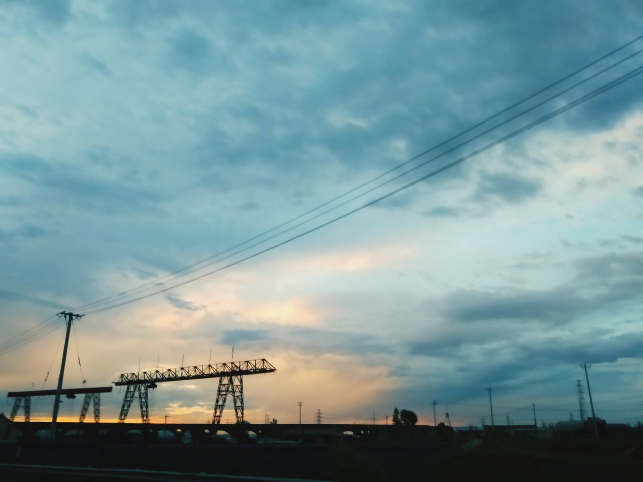 LOW ANGLE VIEW OF SILHOUETTE CRANE AGAINST SKY