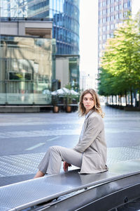 Young woman standing in city