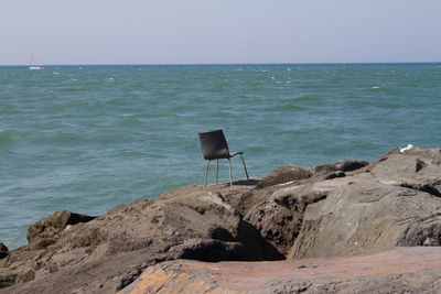 The single chair stay on the dike of fiumicino port.