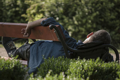 Side view of man lying on land