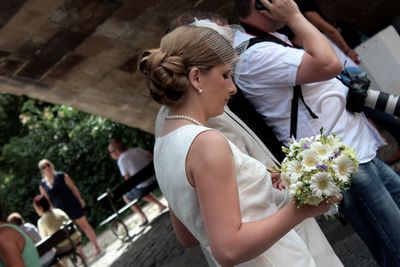 Close-up of woman holding flowers