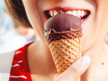 Close-up of woman eating ice cream