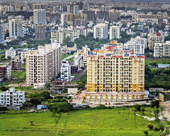 Image of tall buildings under construction near the hill in pune