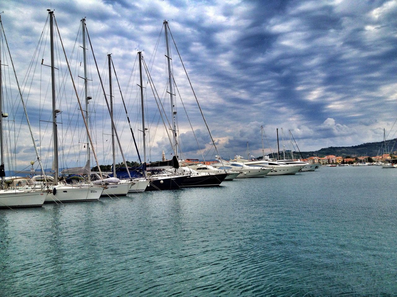 nautical vessel, water, sky, transportation, sea, boat, mast, mode of transport, sailboat, cloud - sky, waterfront, moored, cloudy, cloud, harbor, tranquil scene, tranquility, nature, rippled, scenics