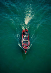 High angle view of man on motorboat in sea