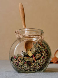 Close-up of glass jar on table