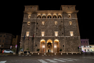 Low angle view of illuminated building at night