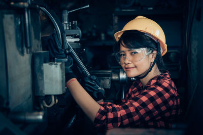 Portrait of woman working in factory