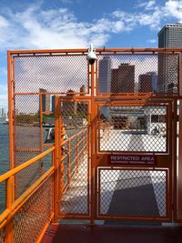 Metal fence against sky