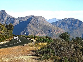 Country road leading towards mountains