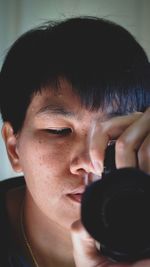 Close-up portrait of man photographing