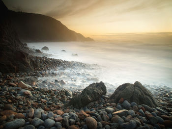 Scenic view of sea against sky during sunset