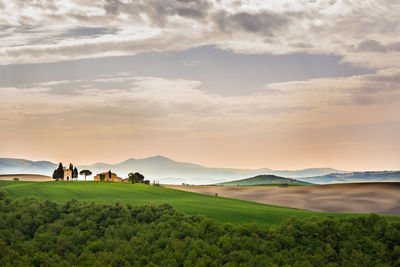 Scenic view of landscape against sky during sunset