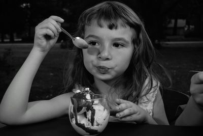 Portrait of girl eating food