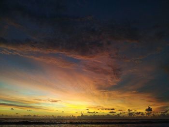 Scenic view of dramatic sky at sunset