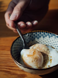 Close-up of hand holding ice cream