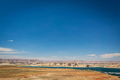 Scenic view of landscape against blue sky