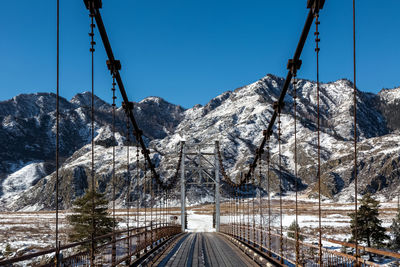 Scenic view of snowcapped mountains against clear sky