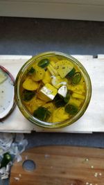 High angle view of chopped fruits in bowl on table