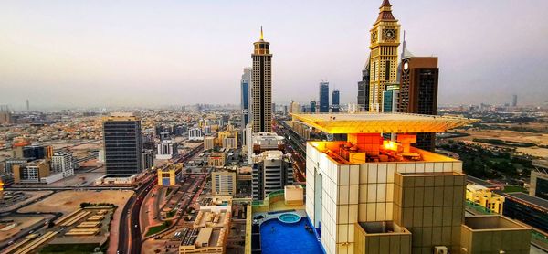 Modern buildings in city against sky