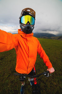 Young caucasian man take a selfie in nature while cycling in the mountains. sport, biker and happy