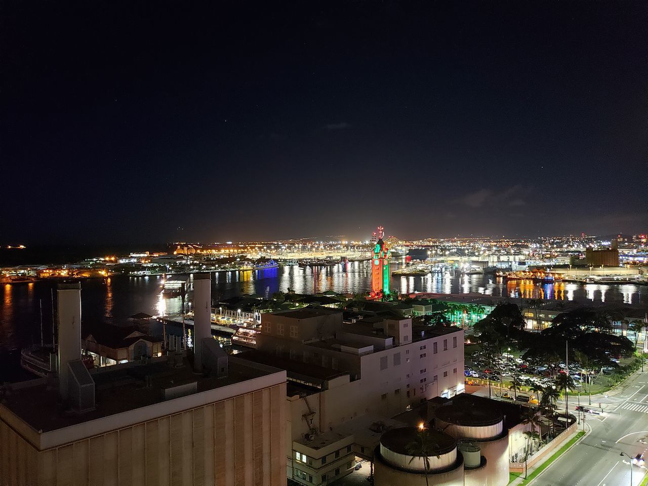 HIGH ANGLE VIEW OF ILLUMINATED CITY BUILDINGS